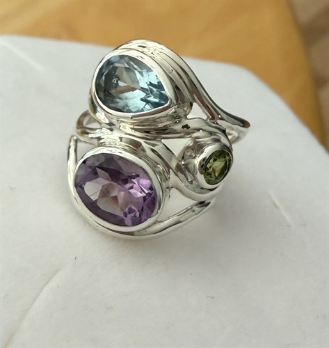 blue topaz, amethyst and peridot swirl ring by Janice Girardi