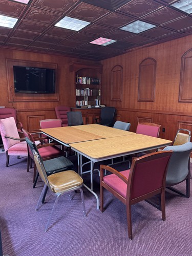 Meeting room can accommodate up to about 15 chairs comfortably.