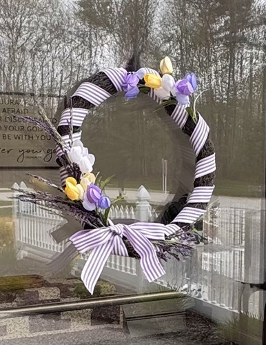Beautiful wreath made by Liz Roper welcomes people to our church