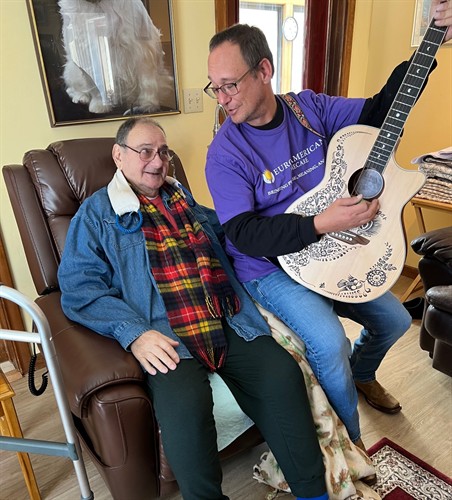 Gallery Image frank_playing_guitar_with_client.jpg