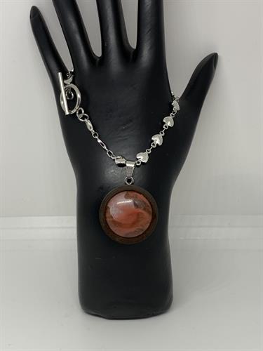 Natural Cherry Quartz set in wood on a stainless steel toggle bracelet. Hand designed.