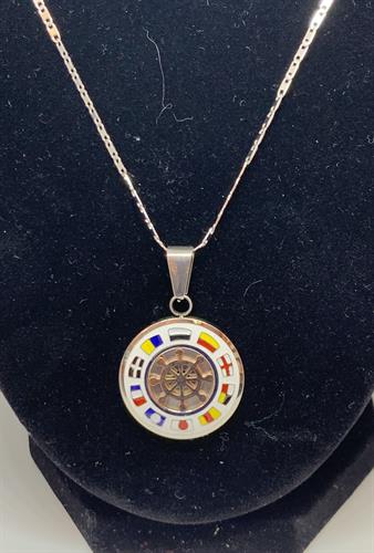 Stainless steel and enamel pendant on a stainless steel chain.