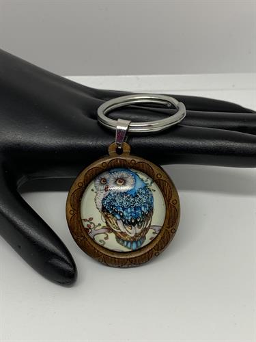 Iron key chain with glass cabochon and wood charm. Hand designed.