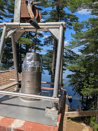 A winch helps with a new 120-pound liner that is being installed