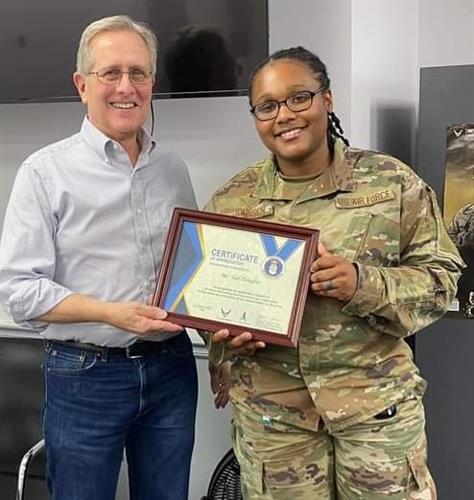 Presented plaque by TSst Erykah Johnson after speaking to Air Force recruits