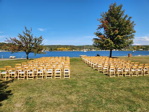 Natural Wood Folding Chairs set up for a Ceremony