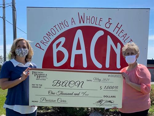 Benzie Area Christian Neighbors accepts a check for $1,000 in May 2021 to support those in their community who are in most need.