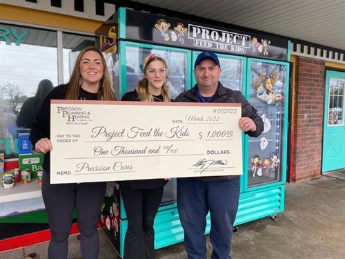 Project Feed the Kids receives $1,000 from Precision in March 2022 to further their mission of feeding hungry children and adults in Northern Michigan.