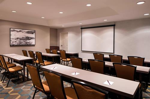 460 sq. ft. meeting room for up to 24 with built in screen