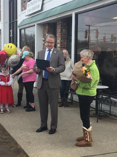 First Selectman dan Rosenthal congratulates Eunice at Bagel Delight.