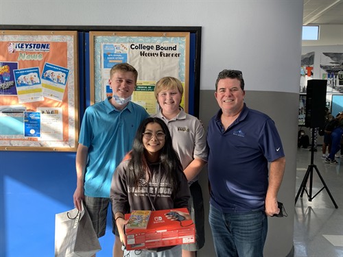 John Medina rewarding top students at the Boys & Girls Club of the Los Angeles Harbor for their hard work in the classroom.