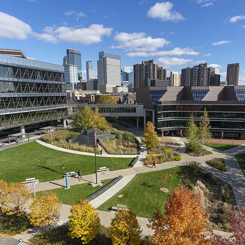 The campus courtyard and the downtown skyline