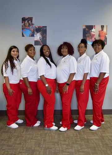 Gallery Image team_in_the_red_pants_in_class_room_standing_.jpg