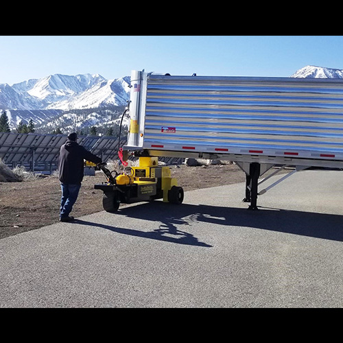Customer maneuvering a loaded semi-trailer with the TrailerCaddy