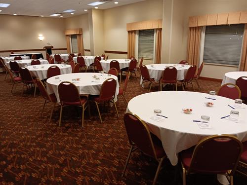 Michigan Room set in half rounds.  THis meeting space can hold up to 99 persons depending on set