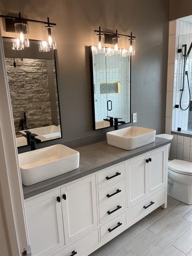 custom Bathroom with concrete counter tops,