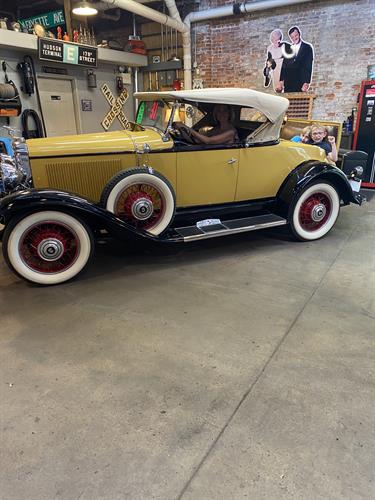 Courtney and the boys in the 1931 Buick Roadmaster