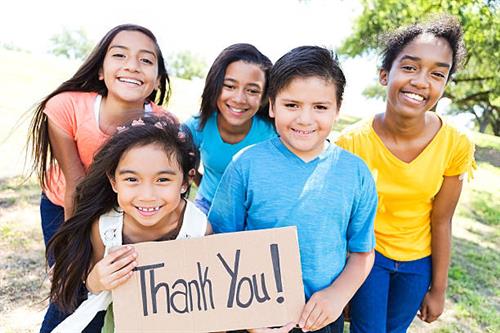 Gallery Image children_with_thank_you_sign.jpg