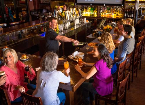 Gallery Image bartender_pouring_wine_guests_interacting.jpg