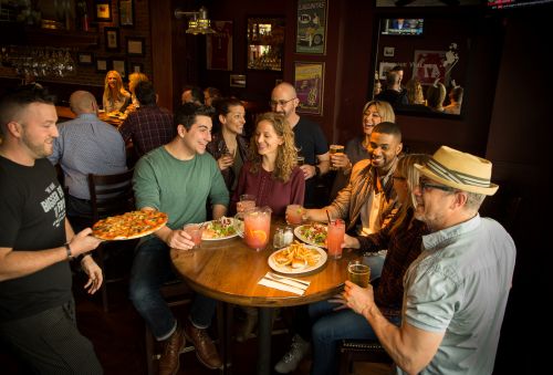 Gallery Image server_bring_food_to_guests_at_hightop.jpg