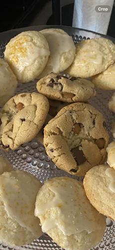 Salted Caramel Chocolate Chunk Cookies surrounded by Lemon Meltaway with Lemon Frosting 