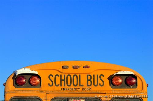 The top of the rear of a school bus displayed against a cloudless sky at the Fort Hayes Bus Compound. Columbus bus drivers are under the microscope after an investigation has found that some have bad driving and criminal records. POY2007 Entry