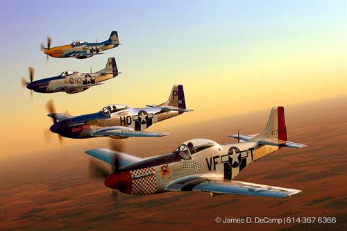 A formation of P-51 Mustangs flies next to my B-25 Mitchell bomber for a photo op over the skies of Pickaway county late Friday afternoon September 28, 2007 during the 2007 gathering of Mustangs & Legends air-show going on at Rickenbacker ANGB.  (© James D. DeCamp 614-367-6366)