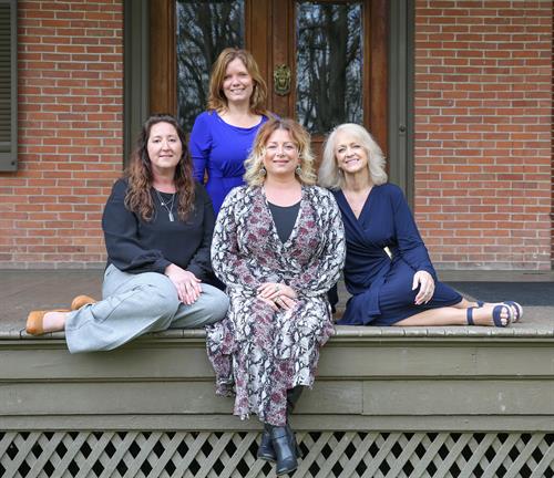 The Beacon women are, front from left, Assistant Editor of Community Events & Activities, Corrie Shiplett; President and Publisher Ali Hermes; and Account Executive Gina Monak-Miller. In the back is Editor Sheri Trusty. 