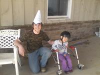 Volunteer Michael Tellup wearing his Birthday Hat designed by Westly Strom during Wesley's lesson