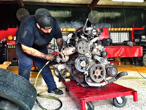 Gallery Image Car_Mechanic_at_Auto_Service_Experts_Local_Automotive_Garage..jpg