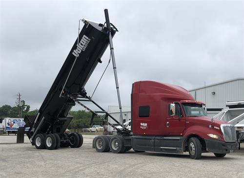 Tractor with Round Bottom End Dump Trailer