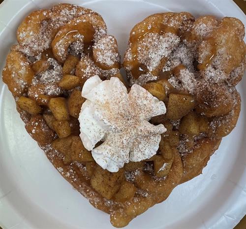 Apple Delight/Funnel Cake with cinnamon apples, caramel, and whiipped topping.