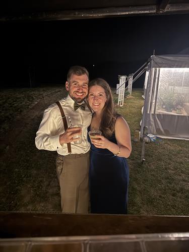 Wedding guests hold signature cocktails at wedding bar service in Keene, New Hampshire