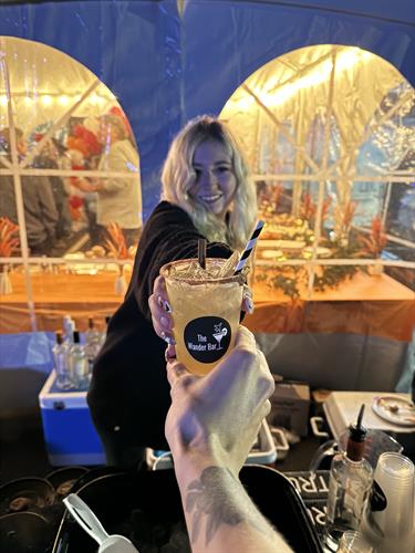 Event bartender for The Wander Bar Mobile Bartending Service serves fall cocktail at Chamber Event in Hampstead New Hampshire
