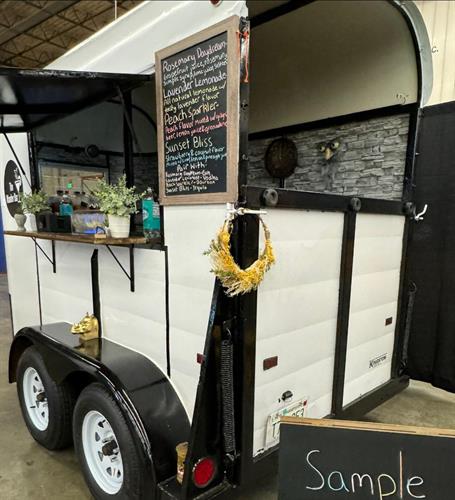 The Wander Bar's mobile horse trailer bar decorated for wedding event in Wilmington Massachusetts