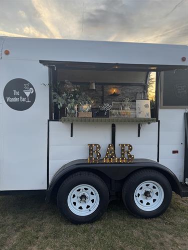 Mobile Horse Trailer Bar decorated for outdoor wedding bar service in Keene, New Hampshire