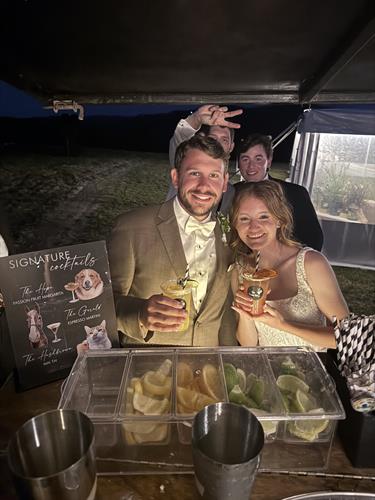 Newlyweds pose with signature cocktails at event bar service in Keene, New Hampshire wedding