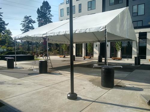 Tent for a company party in the courtyard to the building they just finished building.