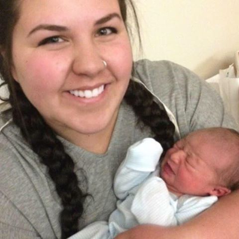 My daughter Lizzy holding our granddaughter.
