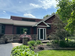 Beautiful new siding, stone, craftsman style front door and new deck. 