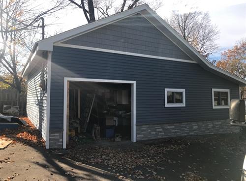 Beautiful after photo of another home on Conesus Lake with new roof, siding and trim.  