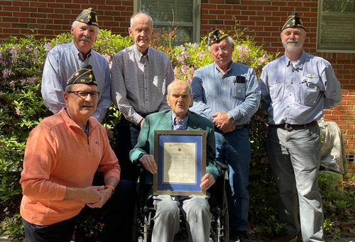 Post 53 members presenting a 75 year continuous American Legion membership certificate to Ellis Parsons.