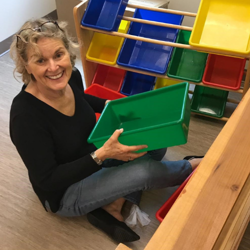 Founder, Jane Robinson helping set up a play room.