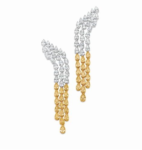 Waterfall earrings with 11.79 carats of white and yellow pear shaped diamonds in 18k white and yellow gold 