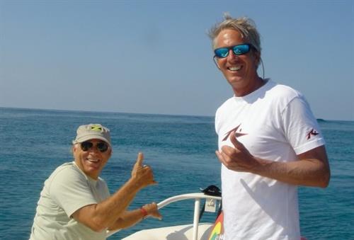 Jimmy Buffett and Rick surfing 