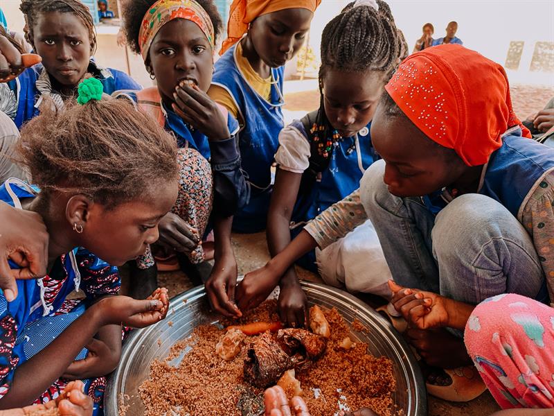 Children sharing a meal at Ettu Allah School in Senegal