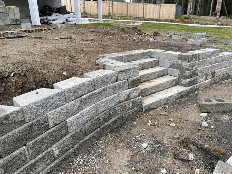 Adding a retaining wall and stairs. 