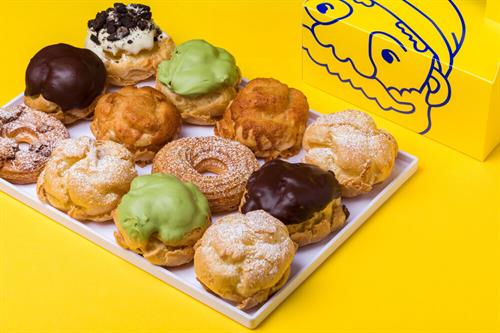Gallery Image white_plate_of_cream_puffs_with_box.jpg