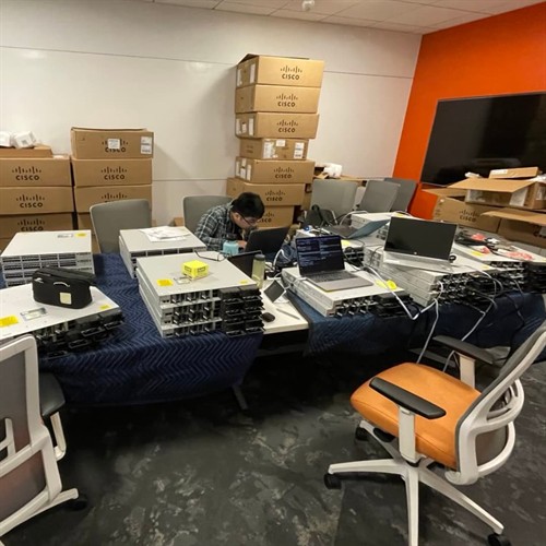 Technician programming network switches in Burbank, CA.