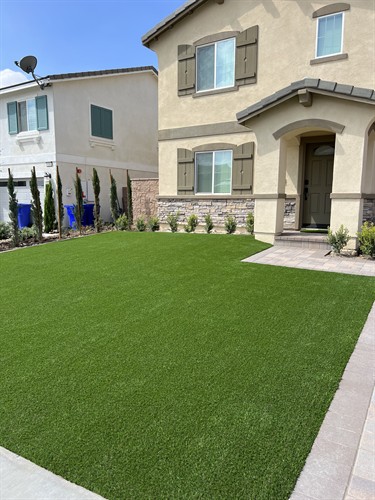 Lush turf paired with premium pavers.